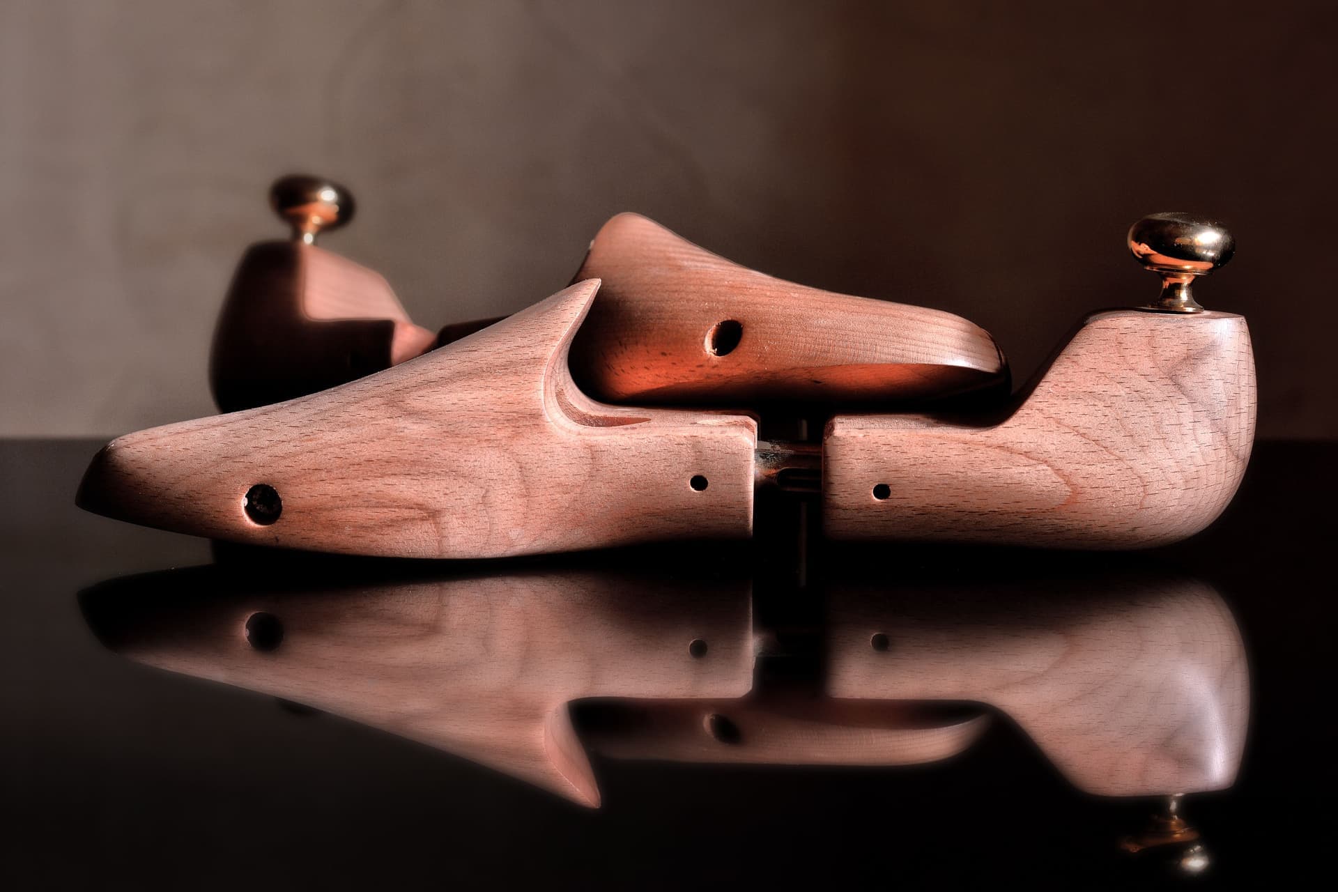 A rigid full-length orthotic insole with a deep heel cup