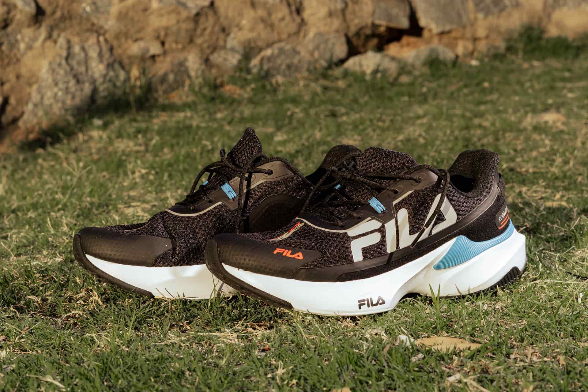 A thick-soled cushioned running shoe in a neutral colorway
