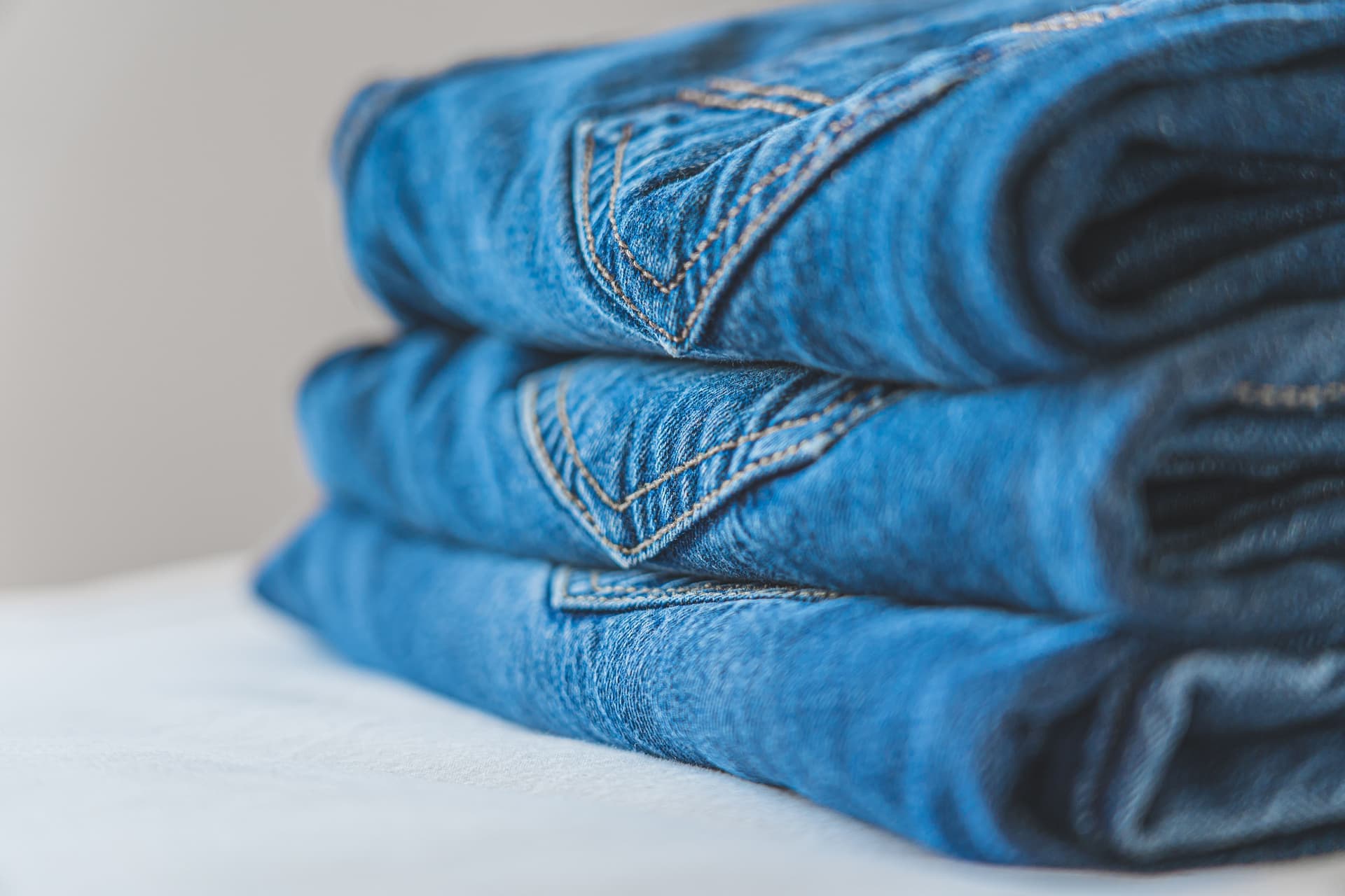 A folded pair of slim-fit scrub pants