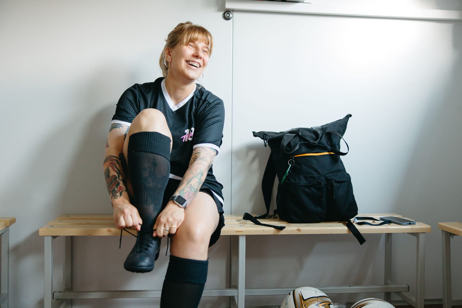 A locker with work shoes and a bag inside