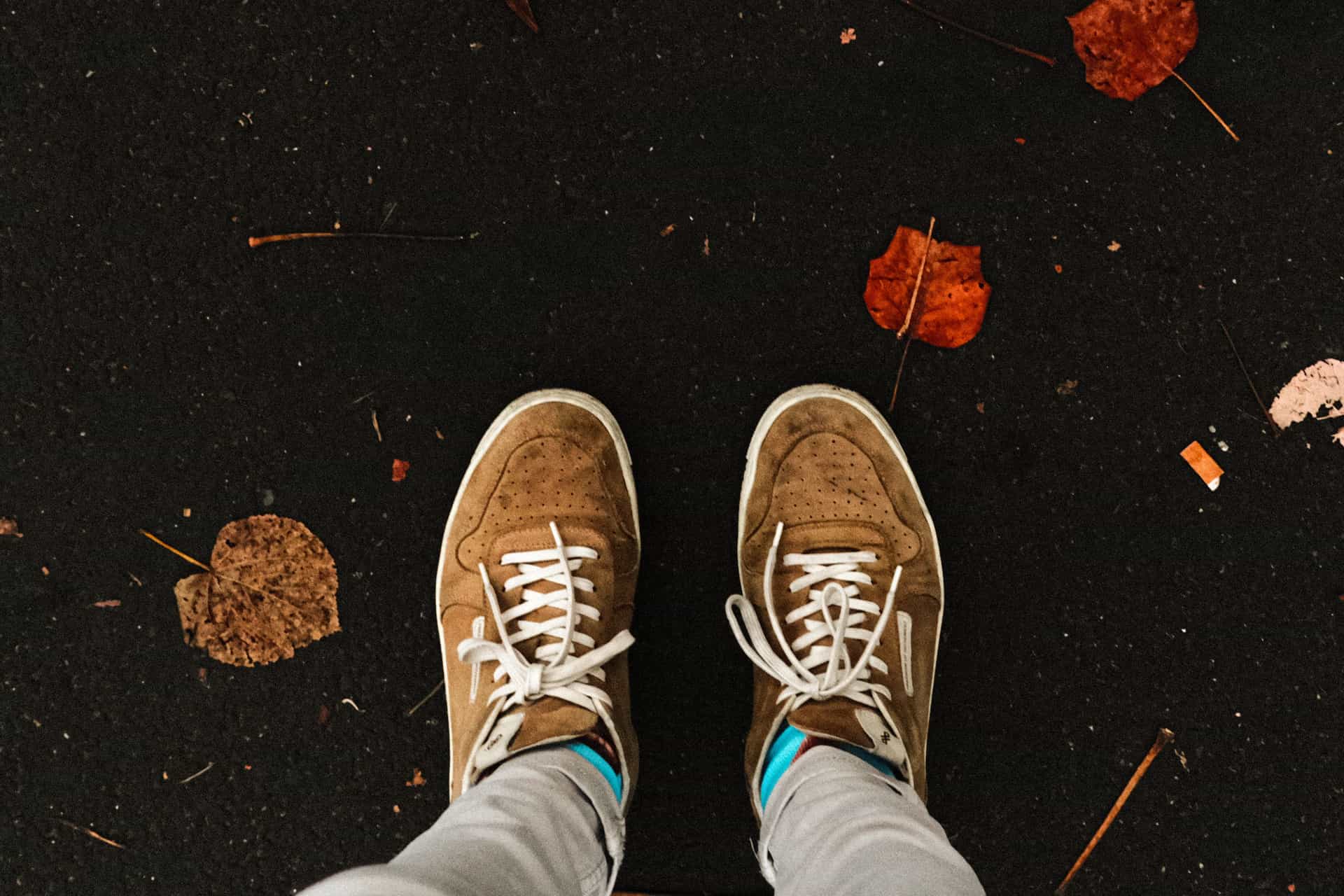 A pair of work shoes on a residential path